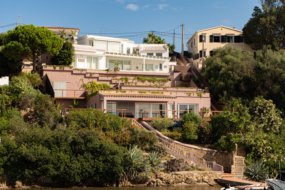 A holiday villa set into a hillside with a wide view